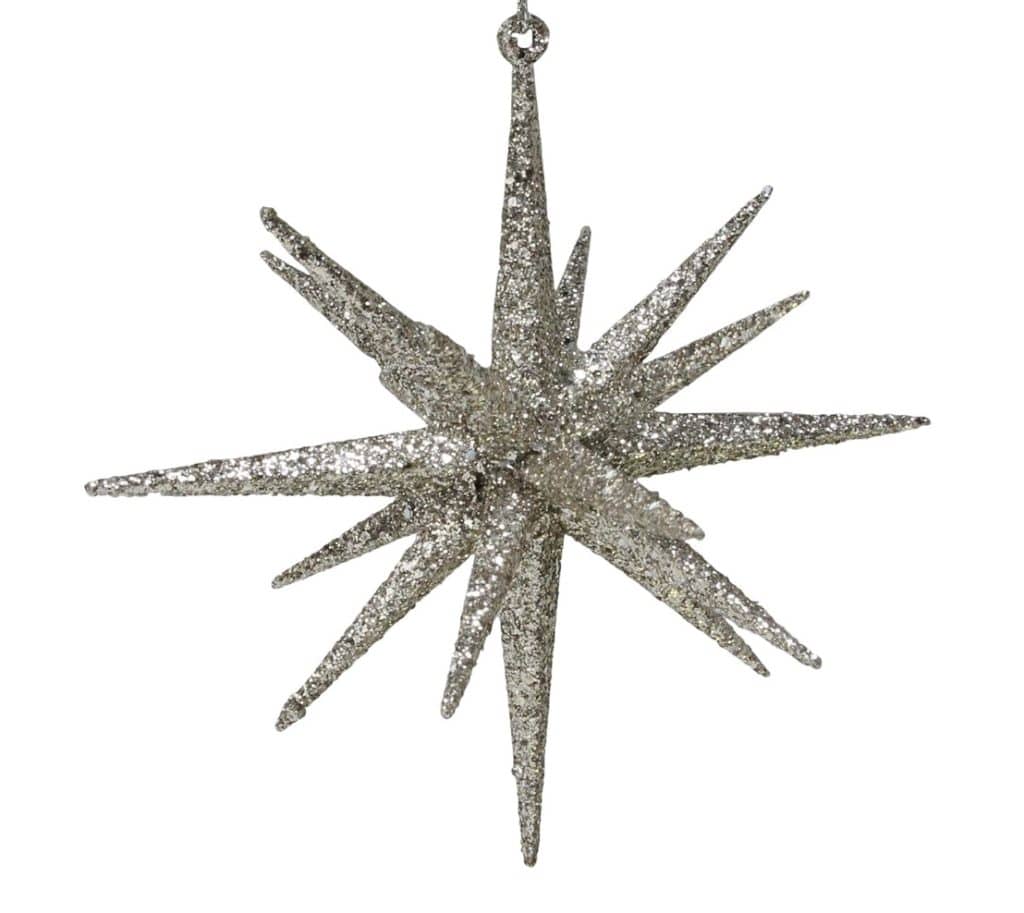 A silver glittery starburst ornament with elongated, pointed rays extends from a central core, perfect for enhancing your Christmas tree. Suspended on a small loop, it complements decorations in hues of brown and gold beautifully.